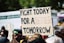person holding fight today for a better tomorrow sign