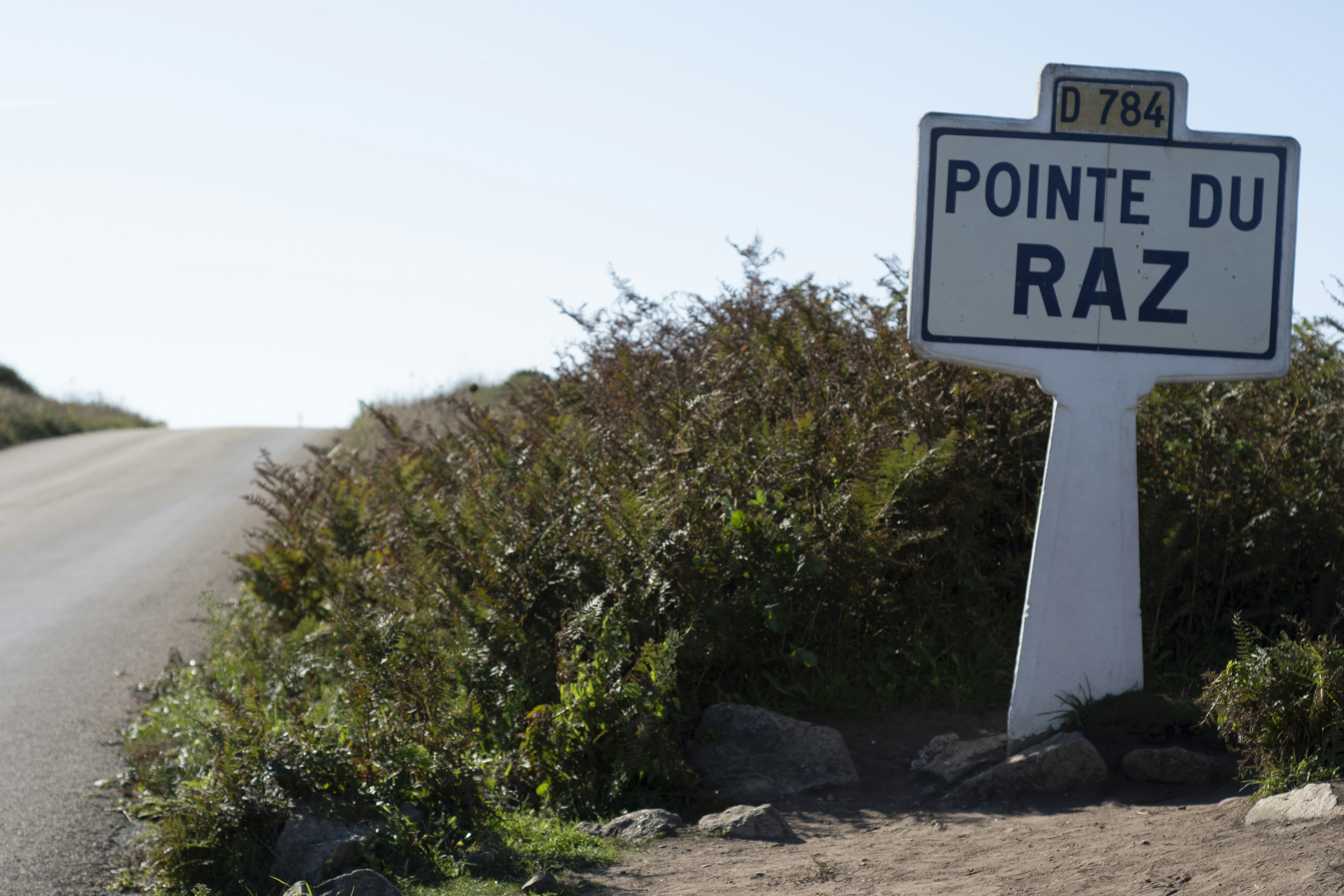 Pointed Du Raz road sign in front of bush