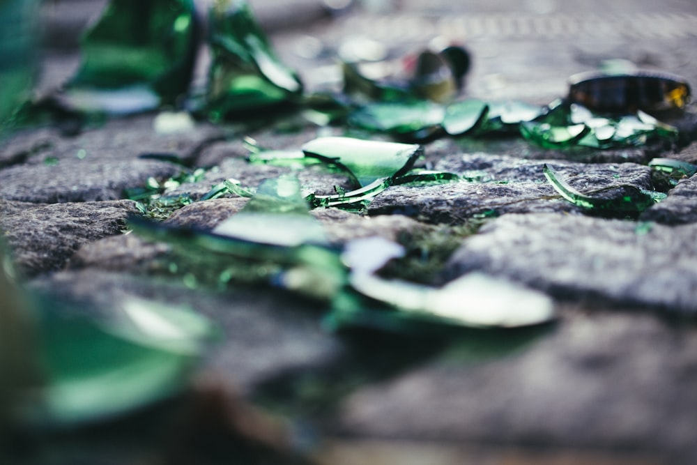 a pile of broken glass sitting on top of a table