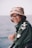 woman wearing green jacket and bucket hat
