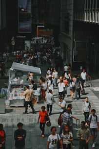 A vibrant street scene in Kingston showing everyday Jamaicans discussing news.