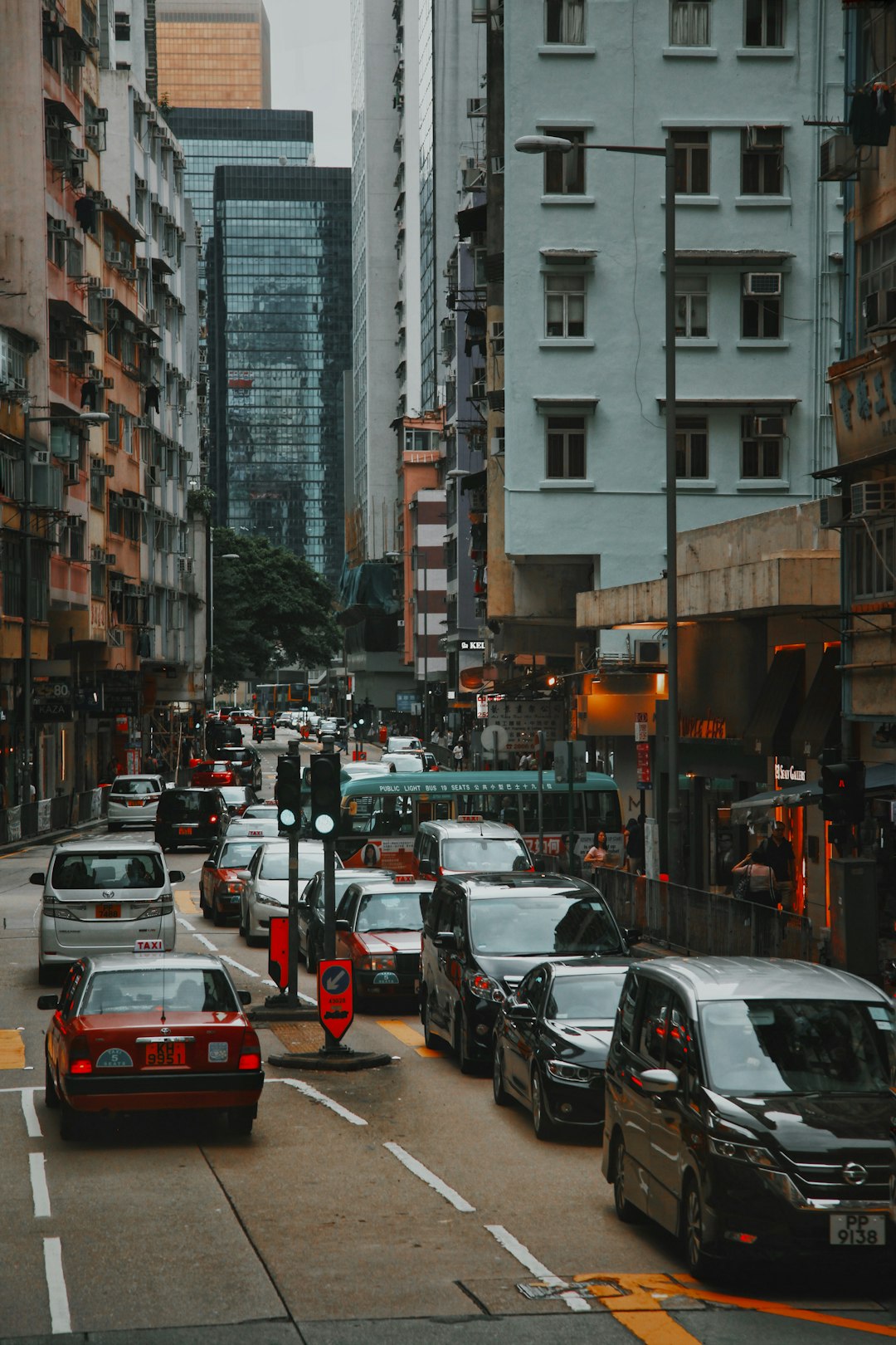 vehicles on road beside building