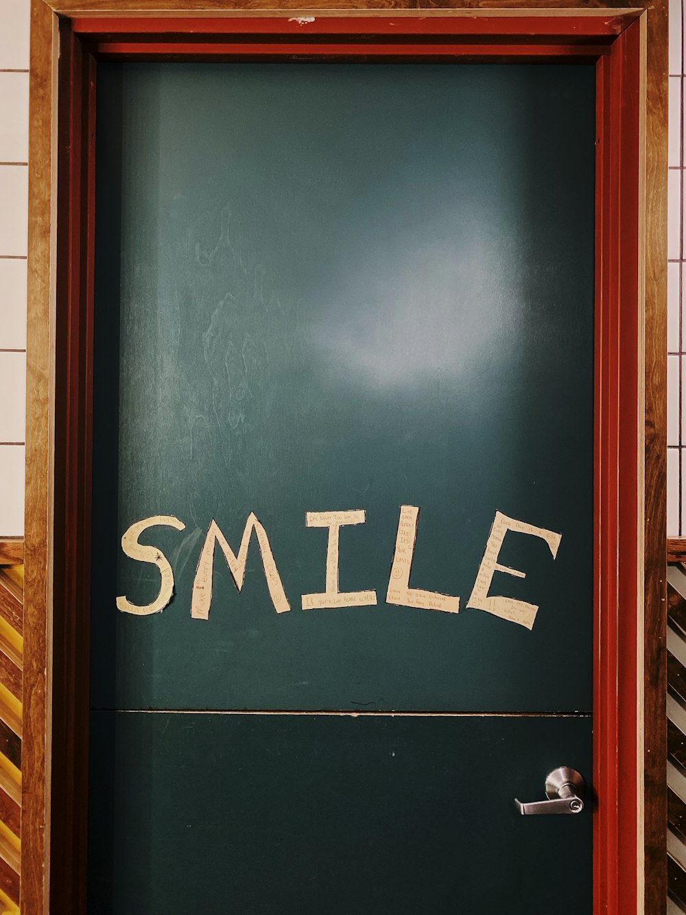 closed blue wooden smile printed door