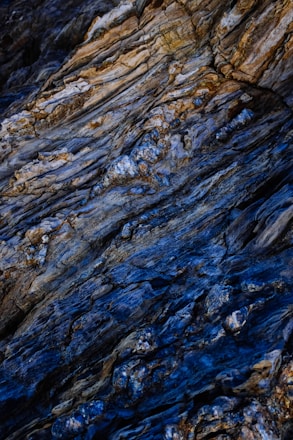 A detailed geological cross-section map with rich earth tones and copper accents.