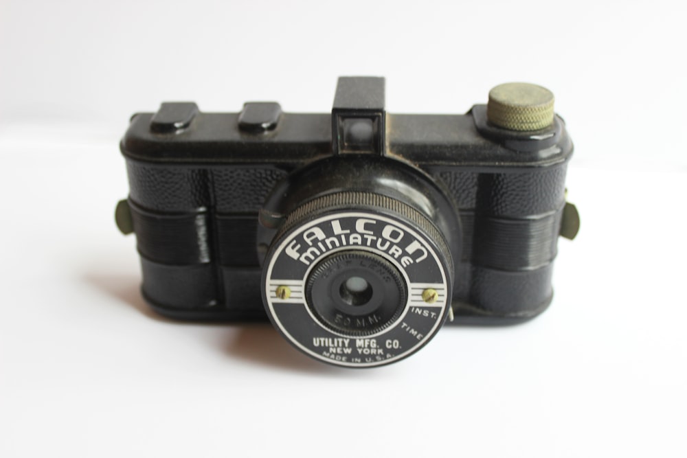 black and gray Falcon miniture camera
