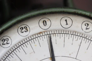 Close-up of a clock showing time ticking towards an event.