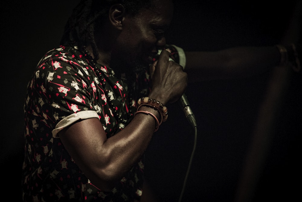 woman holding dynamic microphone