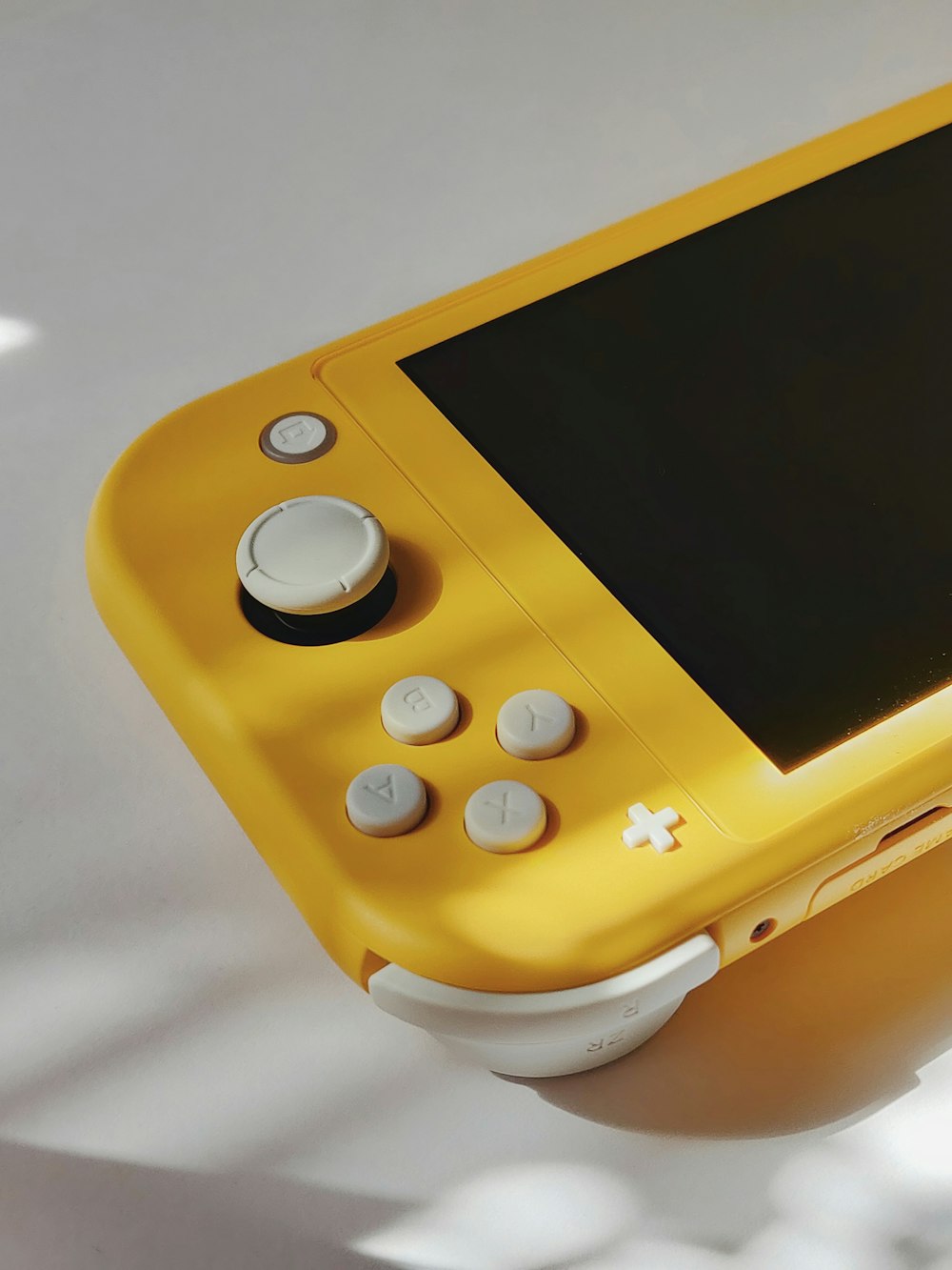 yellow and white game console