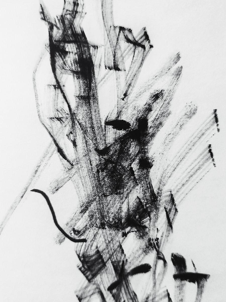 Close-up of ink pen drawing fine lines on white paper