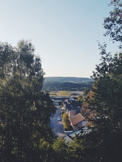 A peaceful view of the Stop Wain Estates site with green fields and local homes in the background.