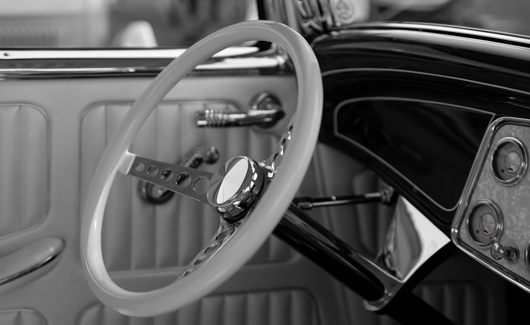 grayscale photography of classic steering wheel