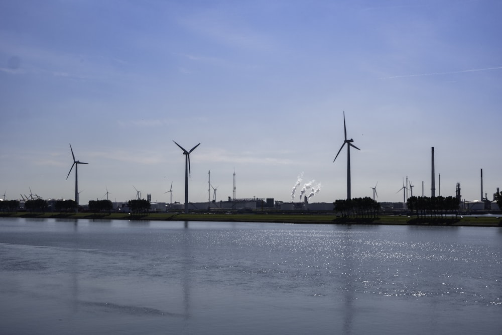 wind turbines near body of water