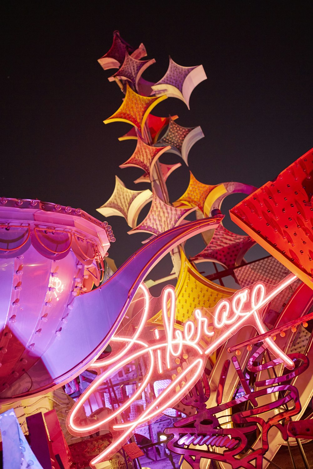 a neon sign is lit up at night