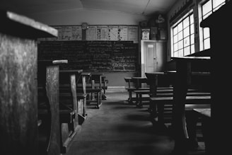 a black and white photo of a classroom