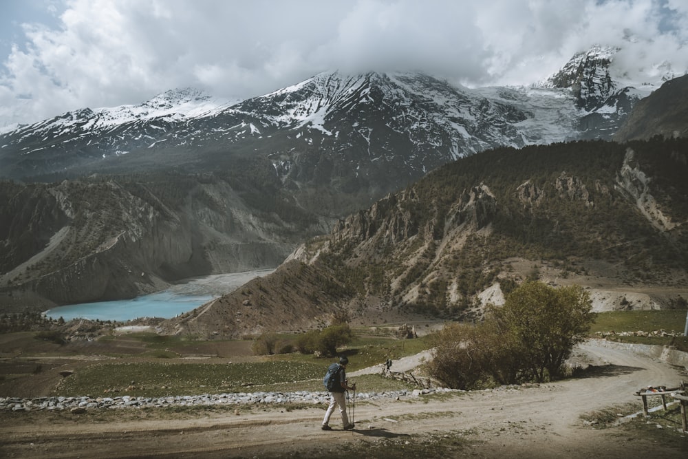 person on road near mountain