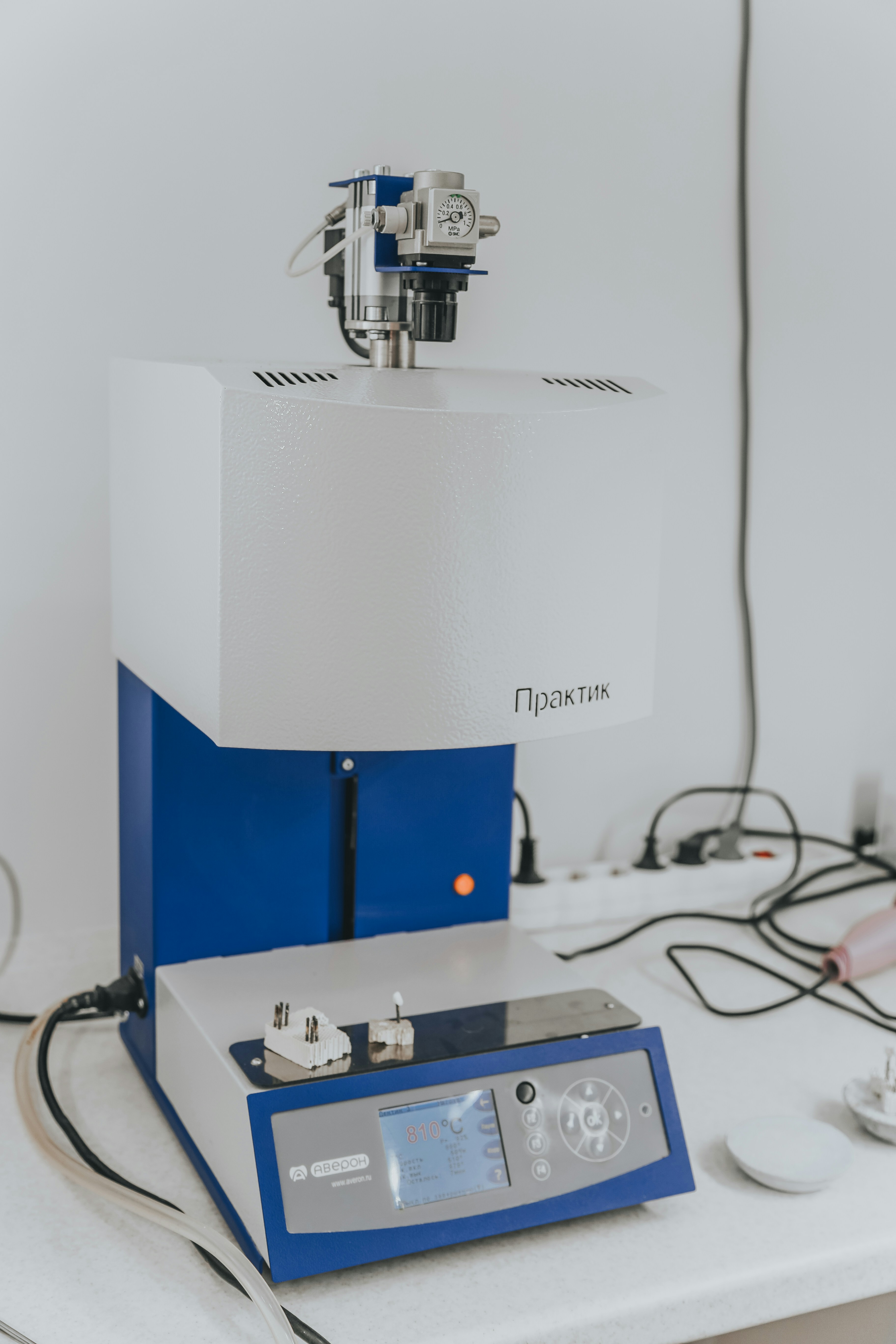 white and blue digital device on white surface