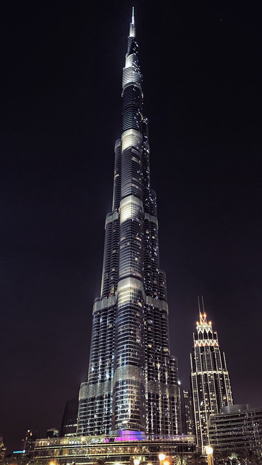 well lighted high rise building at night in Burj Park United Arab Emirates