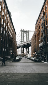 gray bridge near buildings