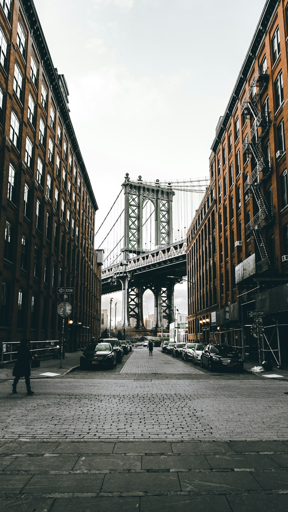 gray bridge near buildings