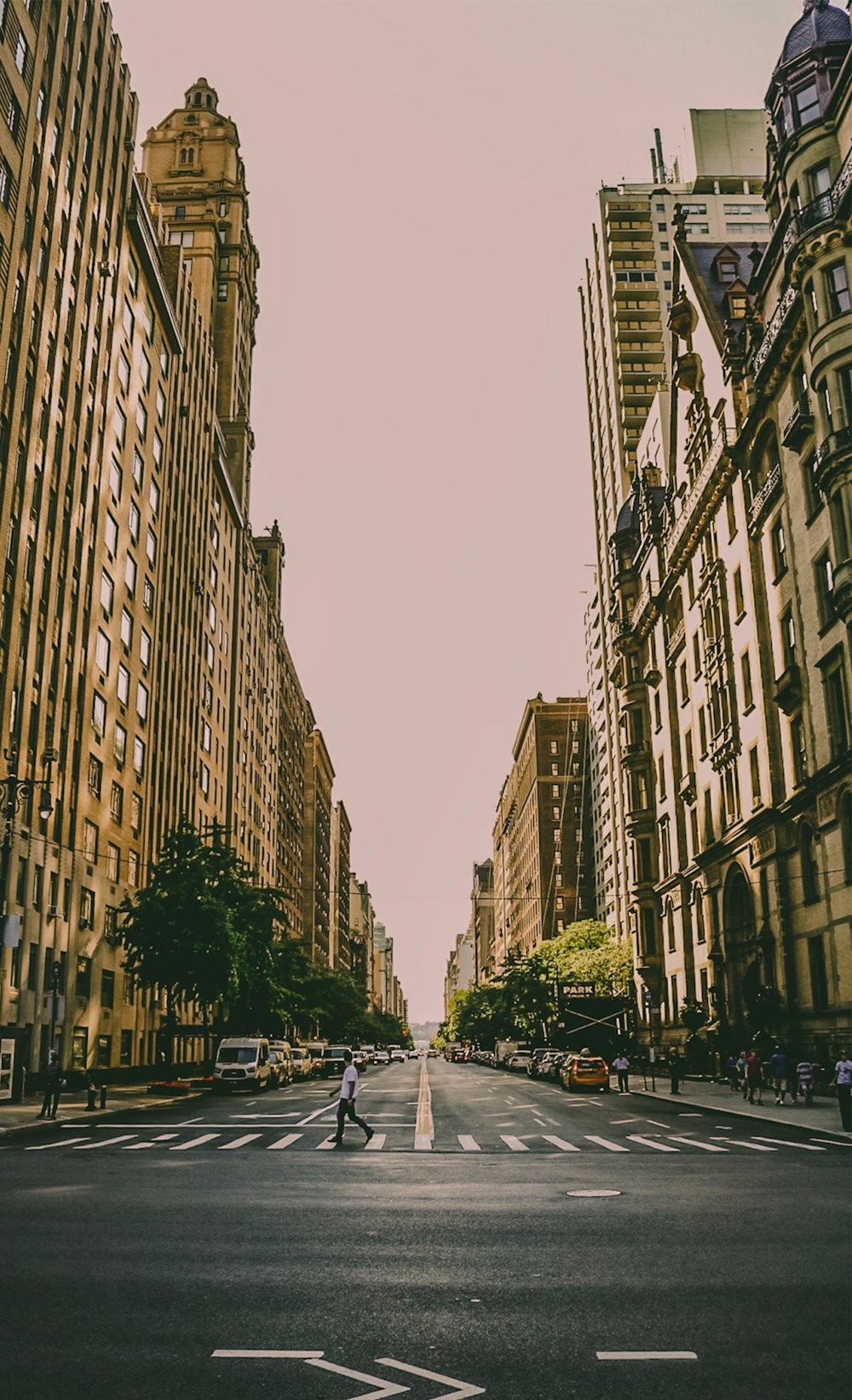 man crossing on Ped Xing during daytime