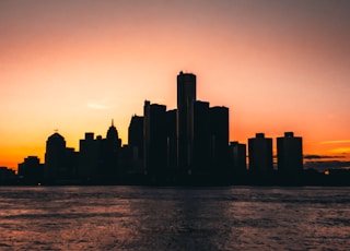 silhouette photography of building during golden hor