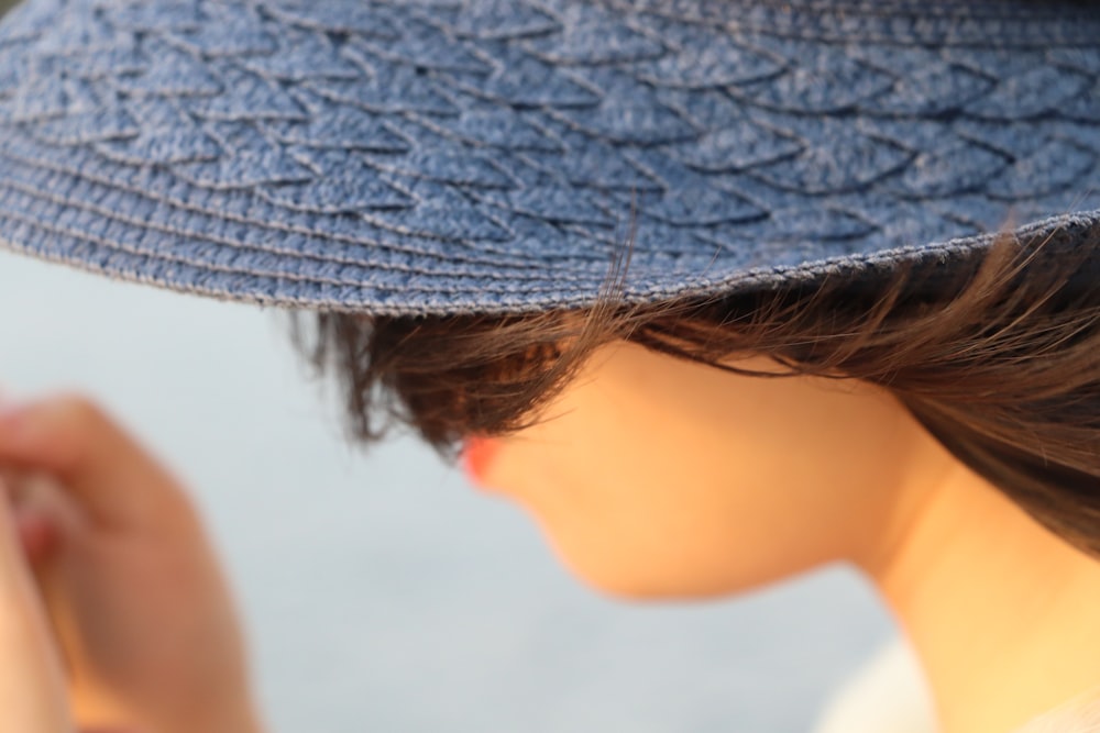 woman wearing gray hat