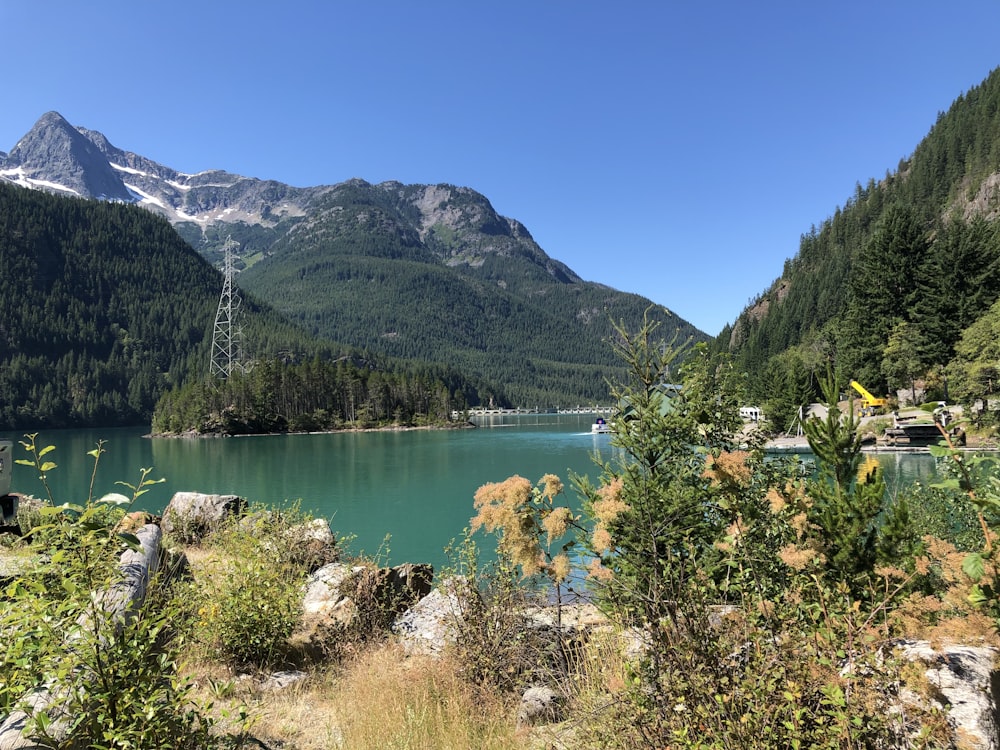 metal tower beside lake