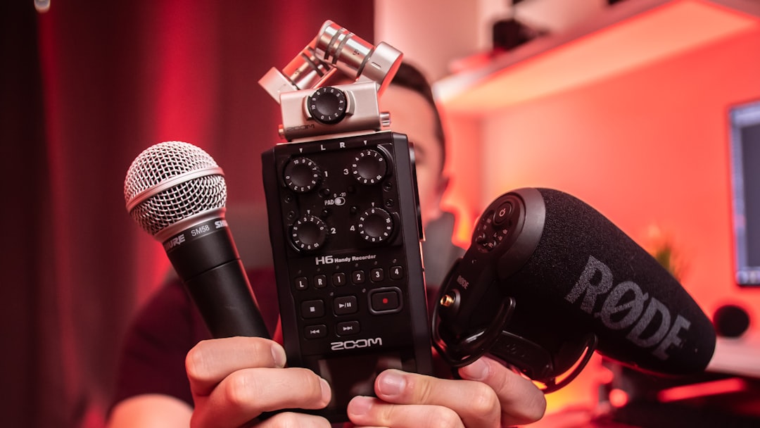 person holding microphones, Audio Gear