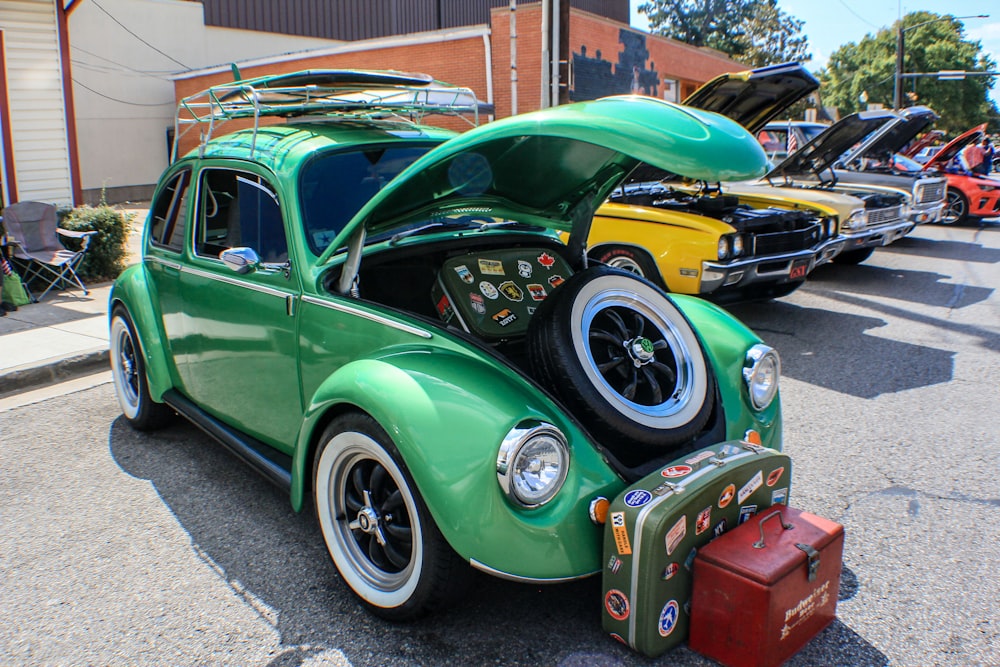 green Volkswagen Beetle during daytime