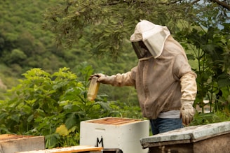 person wearing safety gears holding bottle