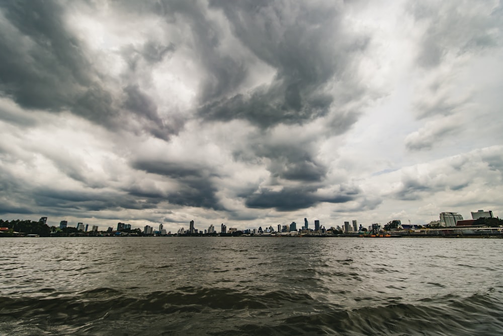 calm body of water under white and grey sky