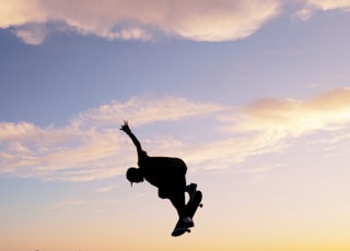 man in midair skateboarding