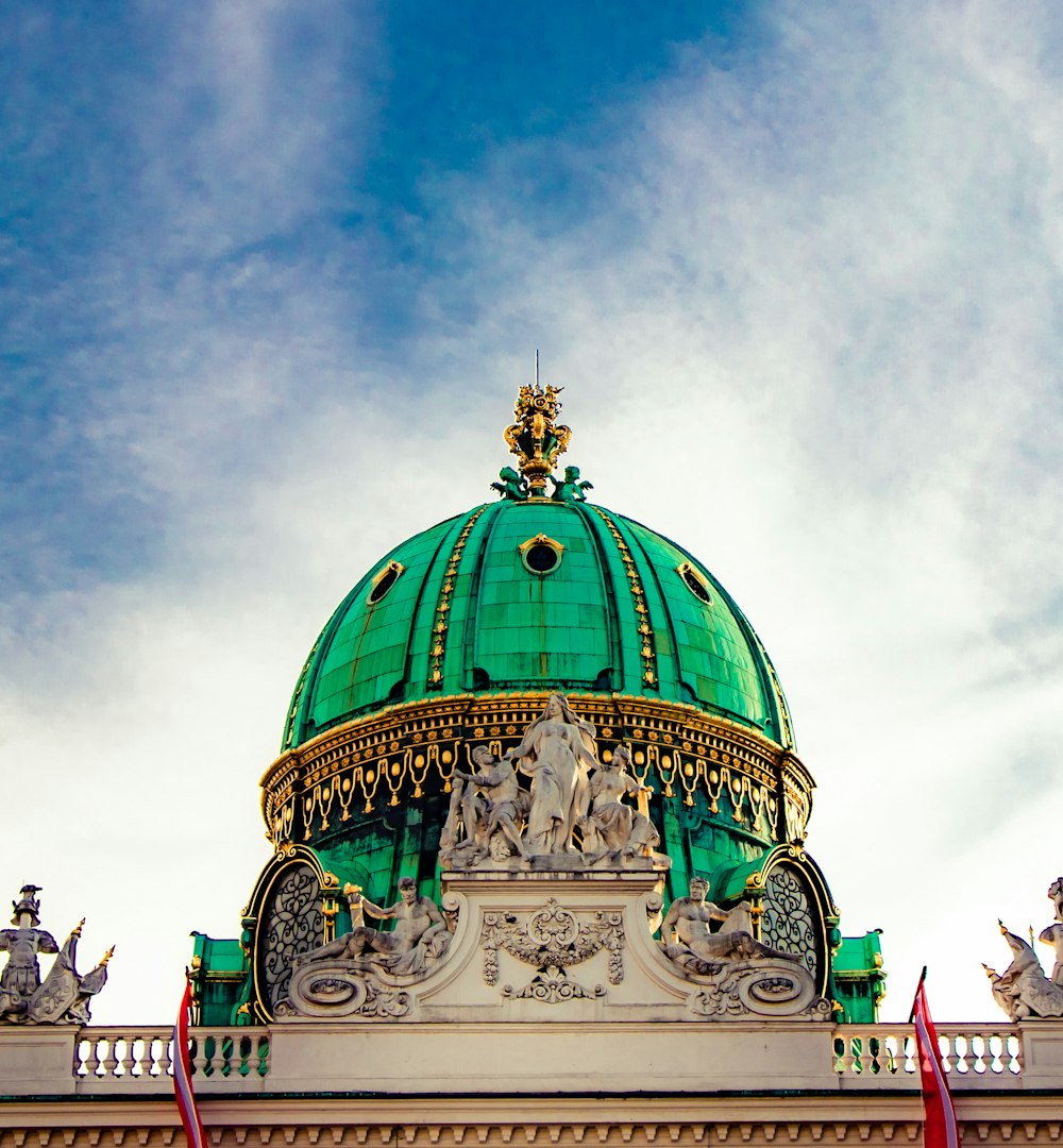 green dome building under cloudy sky