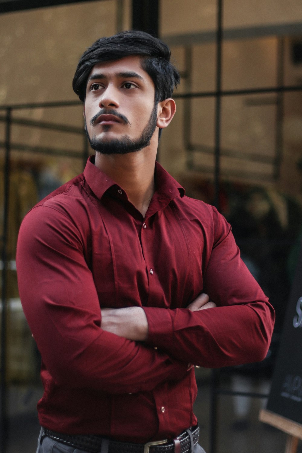 man in red button-up collared top