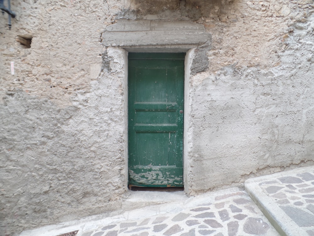 building with closed green door
