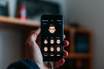 User tapping a glowing round profile photo with emoji overlay on a colorful mobile app interface.