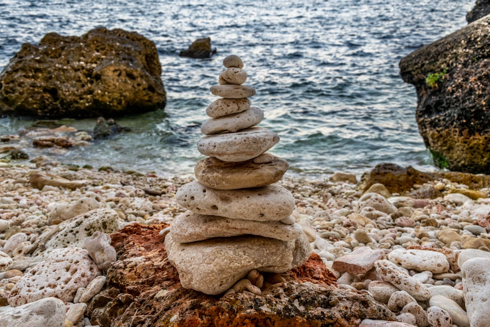 stone cairn on rock boulder