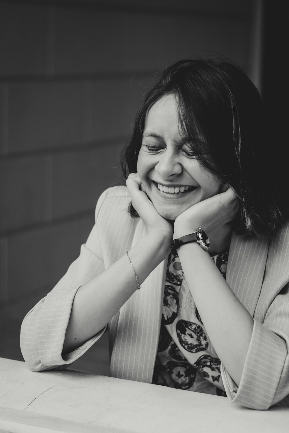 smiling woman sitting at the table