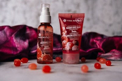 red labeled spray bottle and soft-tube