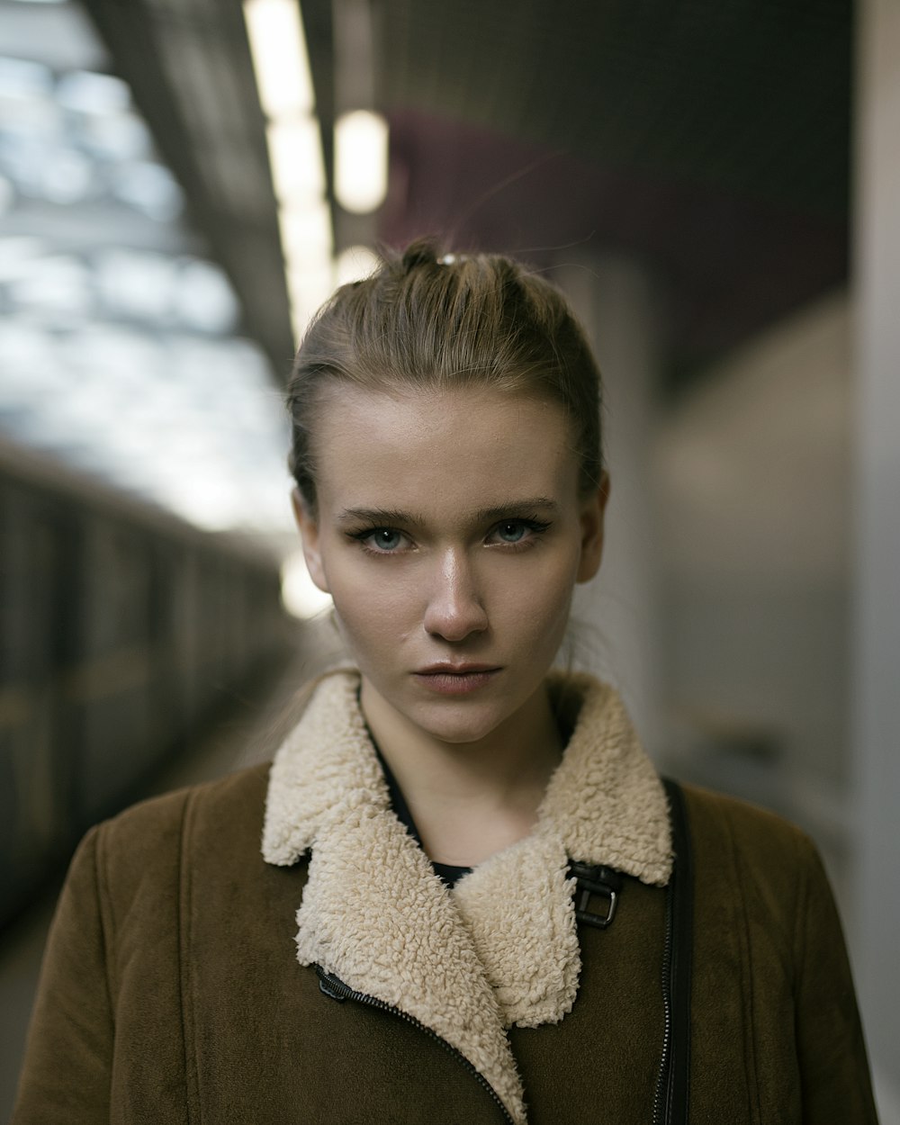 woman wearing brown and white jacket