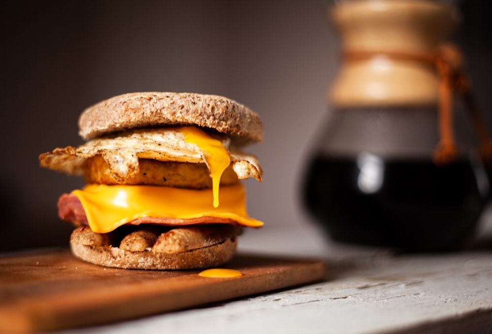 baked burger on wooden surface