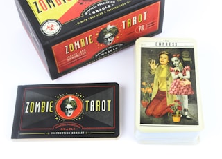 The Zombie Tarot boxed set of deck of cards, guidebook and more features cryptic drawings of the four arcana.