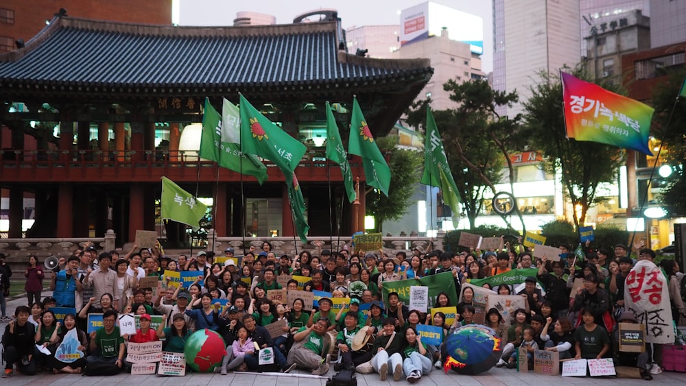 a large group of people standing in front of a building