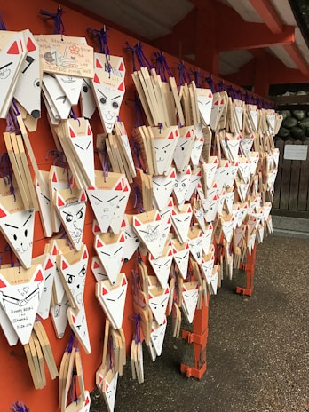 Animal wall stickers of playful foxes and owls arranged on a children's bedroom wall.