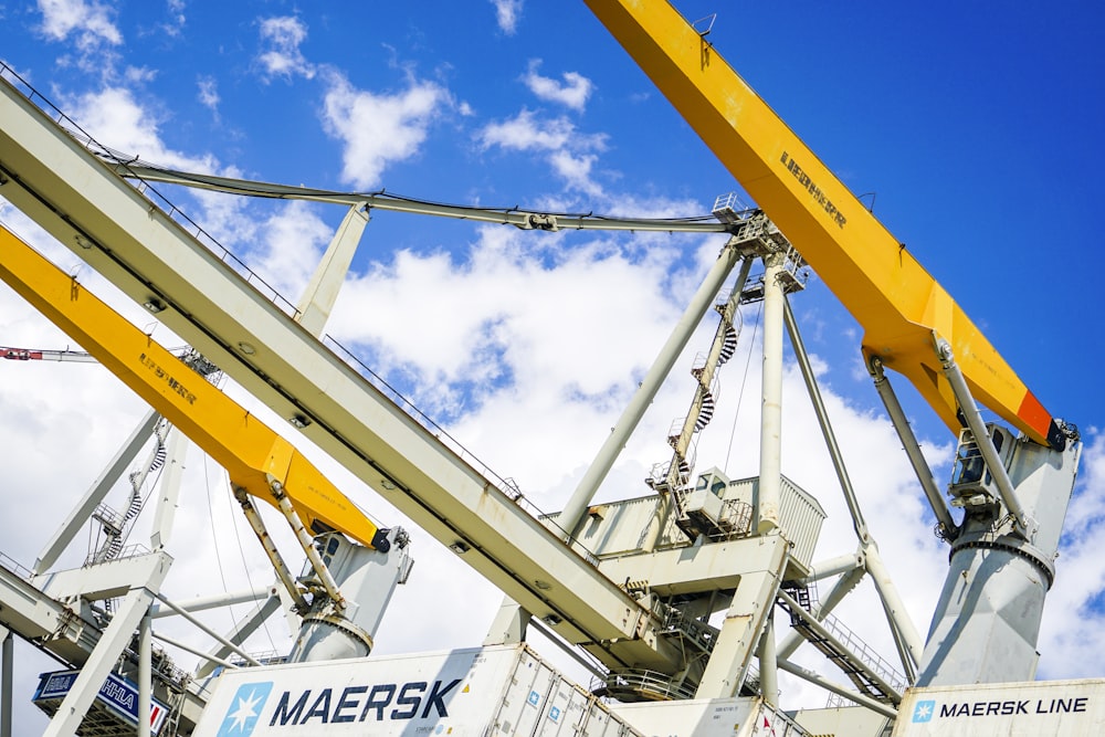 a crane is lifting a container onto a truck