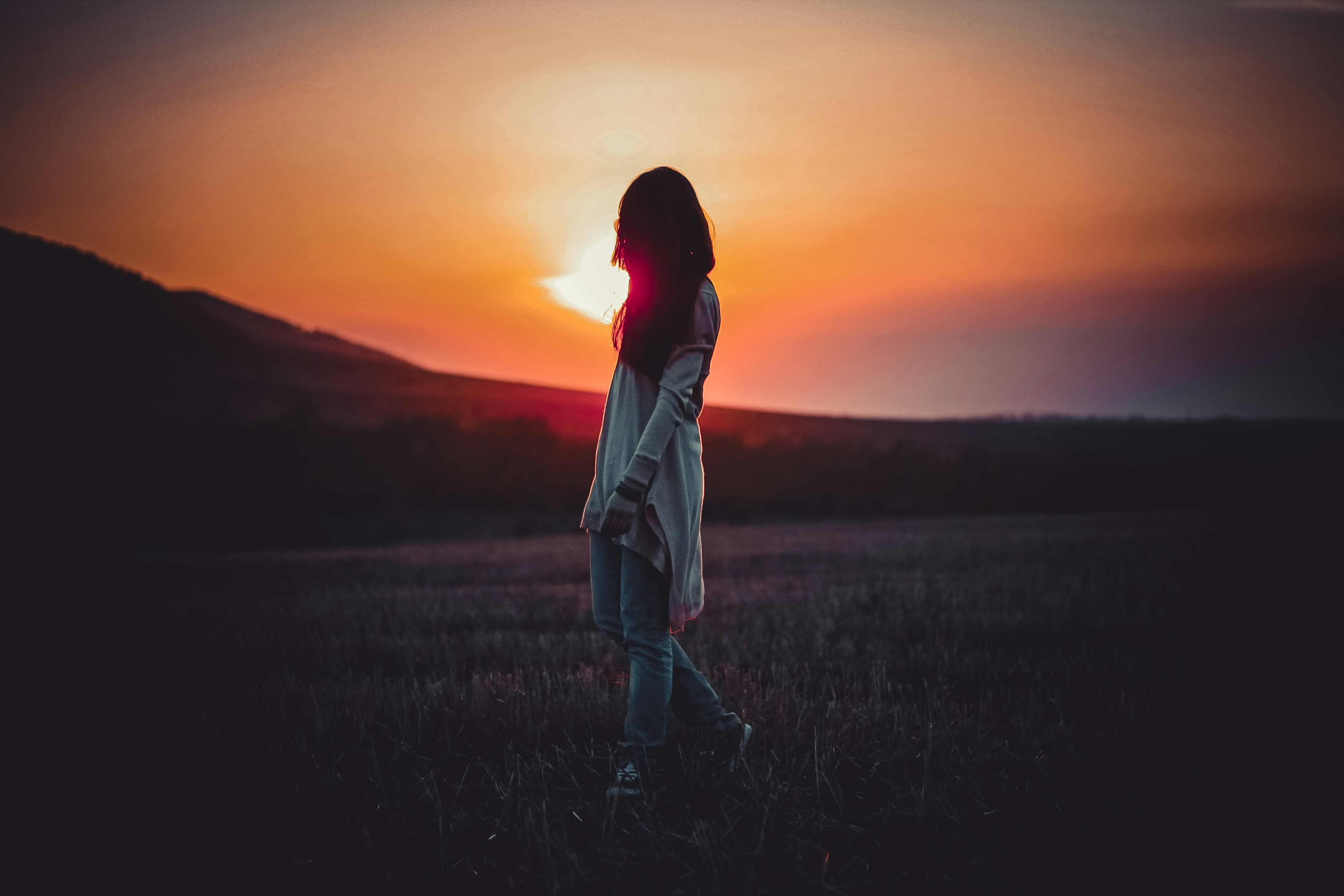 Woman experiencing hope at sunrise