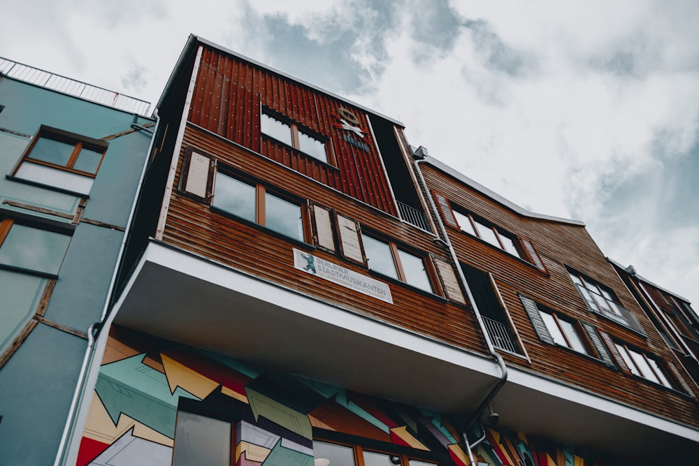 low-angle photography of red and gray concrete building