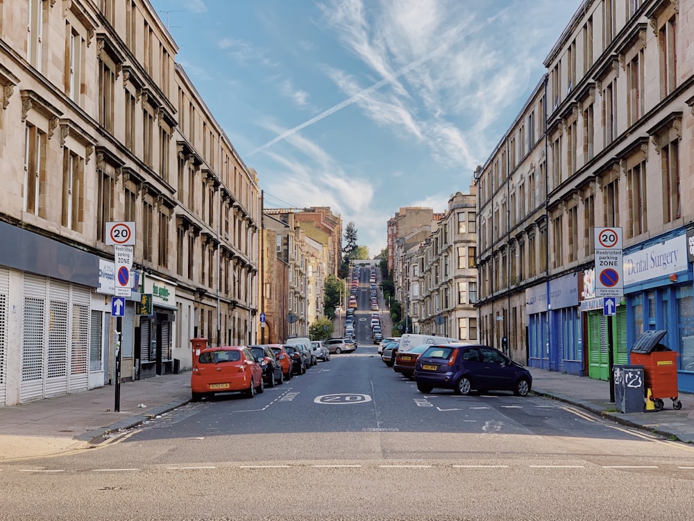 photography of vehicle parked beside road during daytime