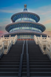 low-angle photography of blue 3-storey cone temple
