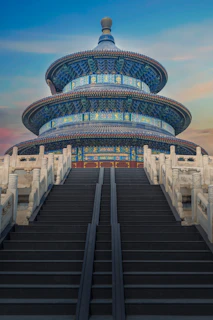low-angle photography of blue 3-storey cone temple